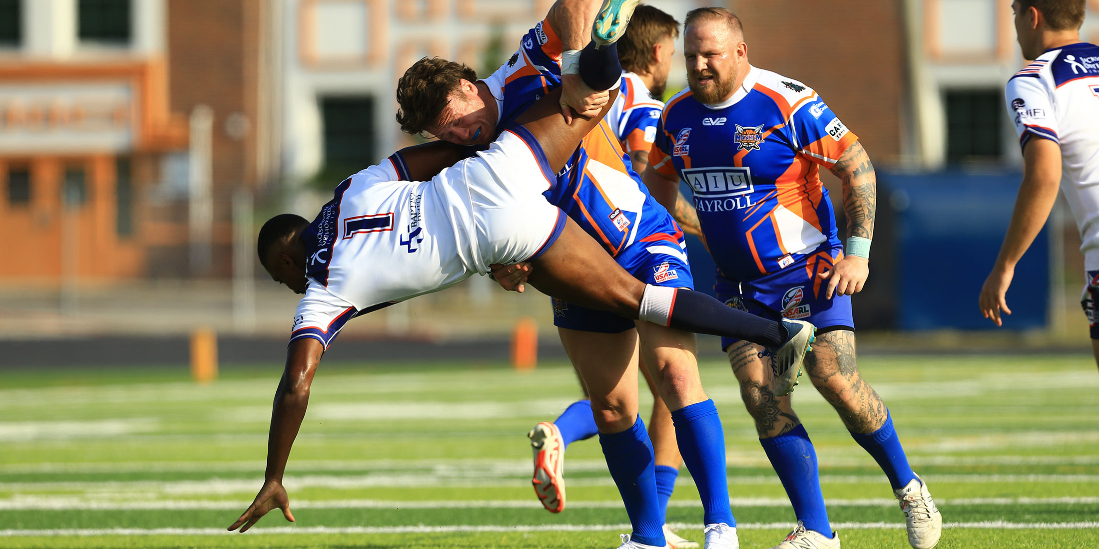 rugby player getting tackled